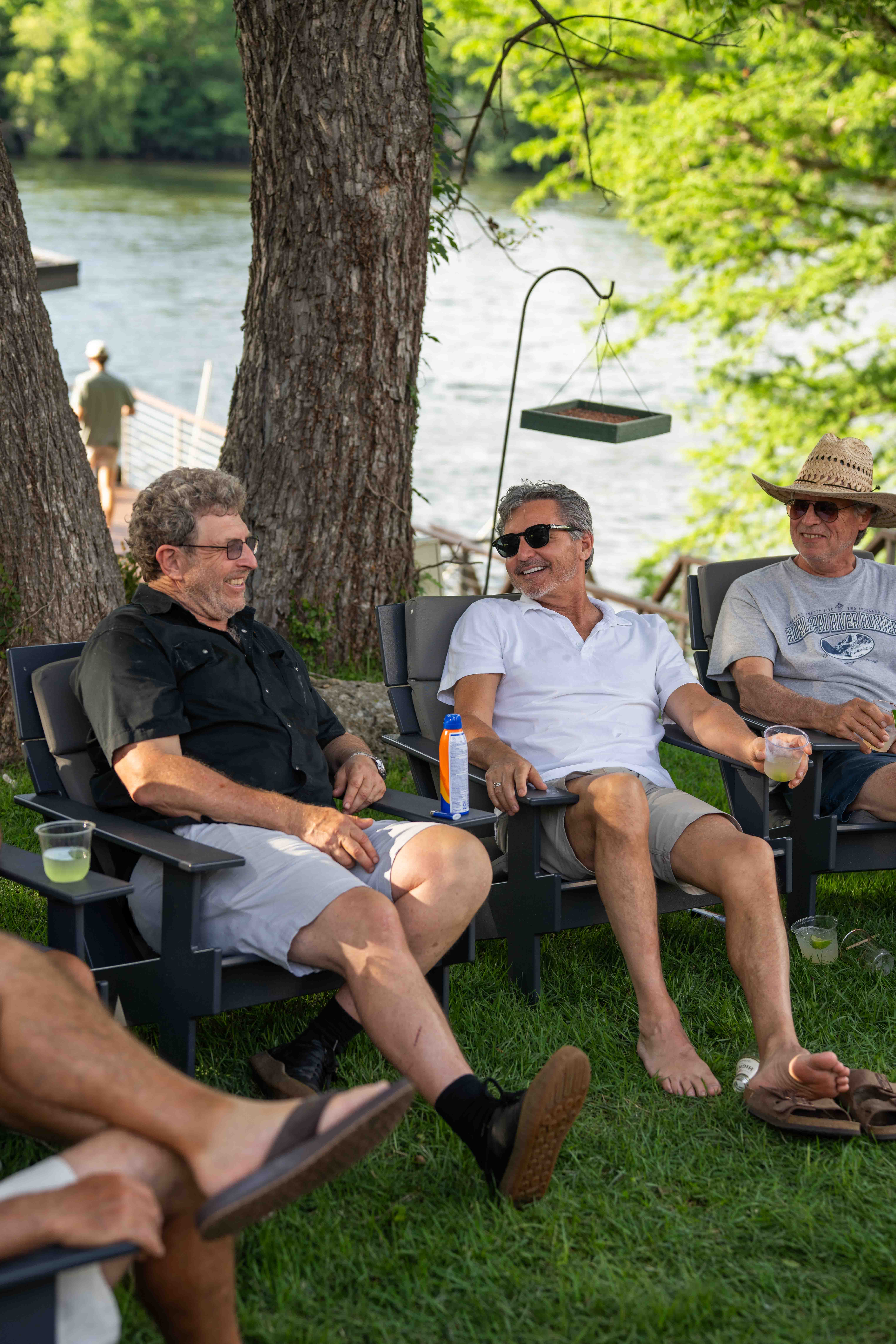 Guests relaxing riverside at a Good Life event